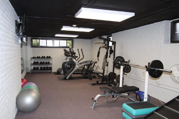 indoor gym filled with exercise equipment